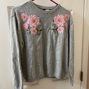 Grey sweater with flower detail